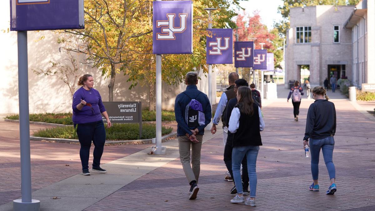 Campus tour guide giving a tour.